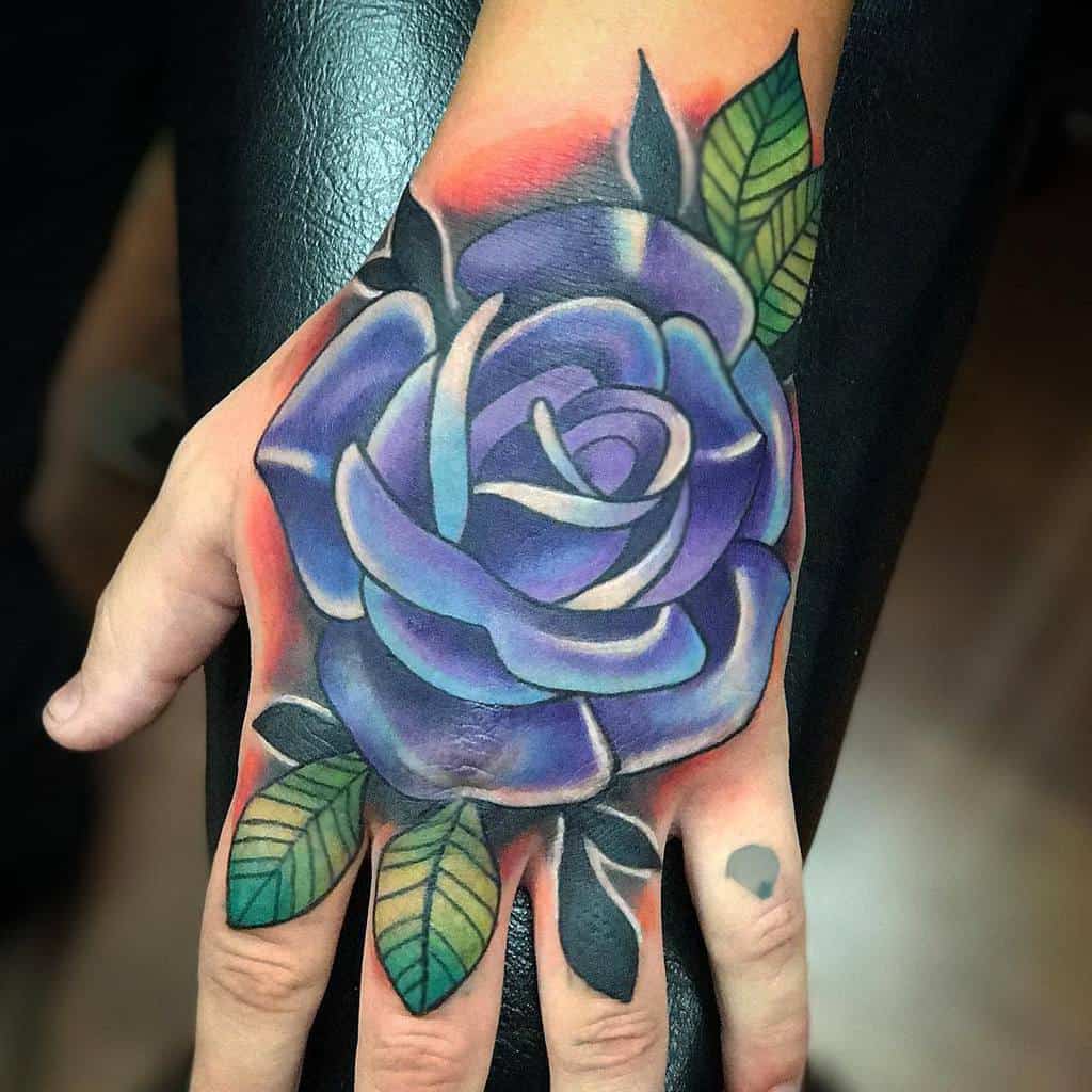 Purple Flower Hand Tattoo melissa_daye