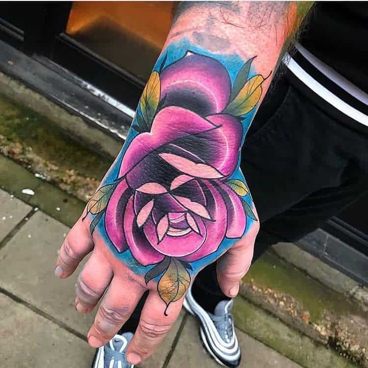 Purple Flower Hand Tattoo westlondoninktattoos