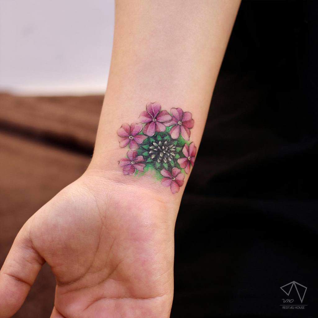 Purple Flower Wrist Tattoo uno.tat