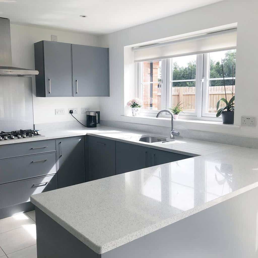 simple modern kitchen gray cabinets white quartz countertop 