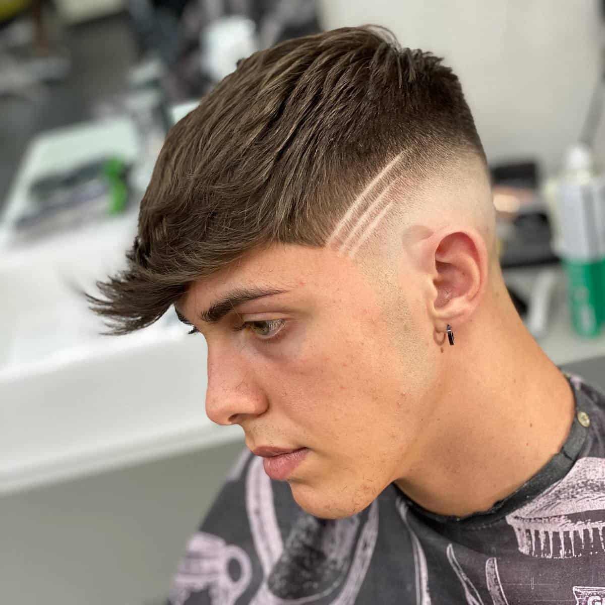 Razor fade haircut with a design