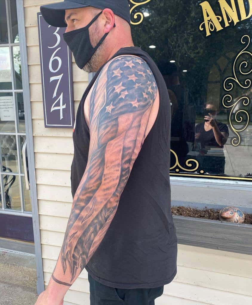 Ripped American Flag Sleeve Tattoo andromedaerie