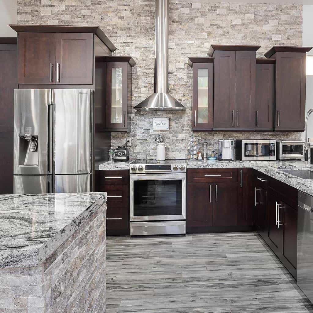 rustic kitchen brown wood cabinets gray tile wall and vinyl flooring 