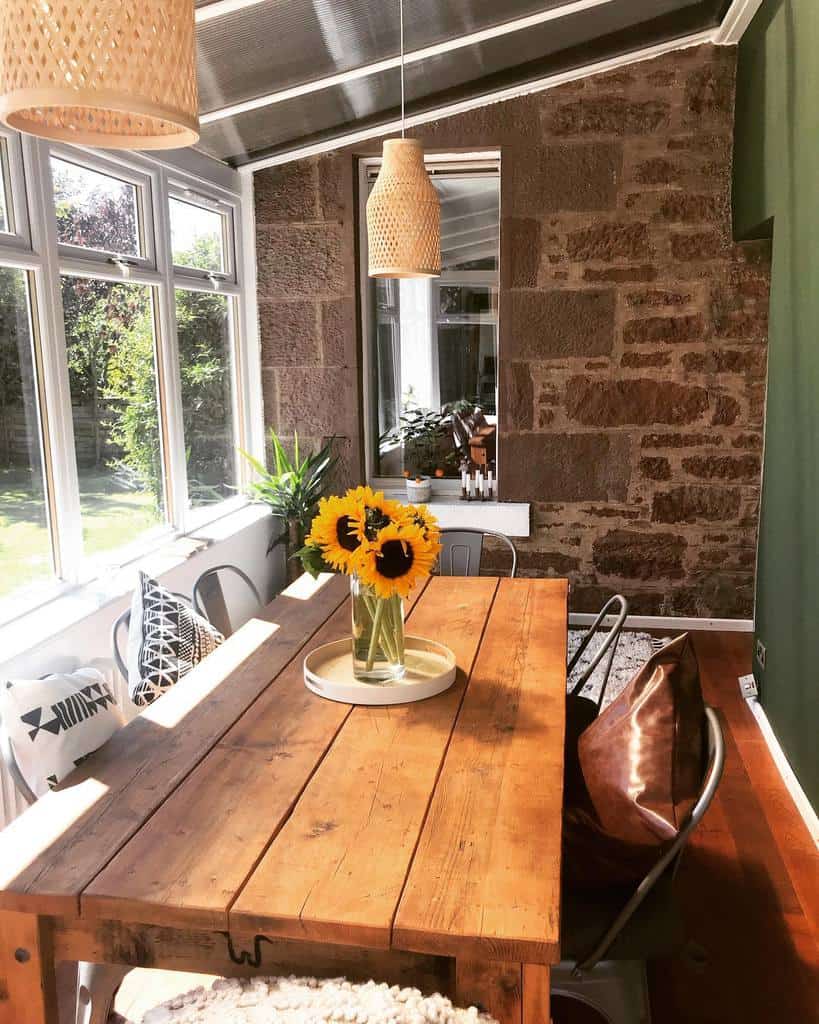 small rustic sunroom with wooden table 