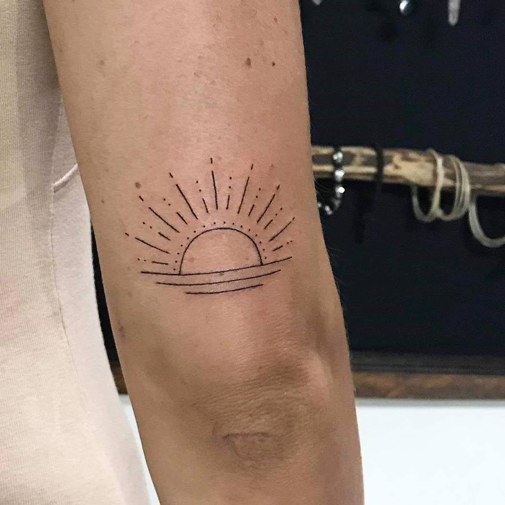 Simple Sun Upperarm Tattoo skizo.tattooo