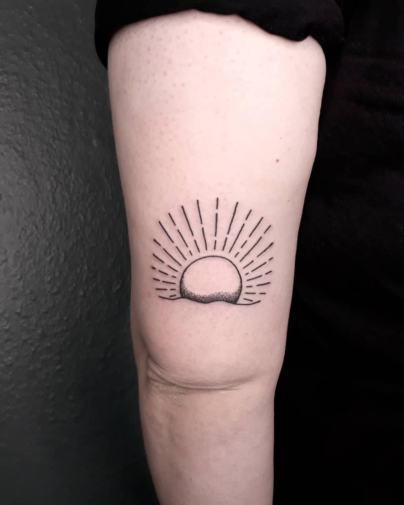 Simple Sun Upperarm Tattoo spellbound_tatto