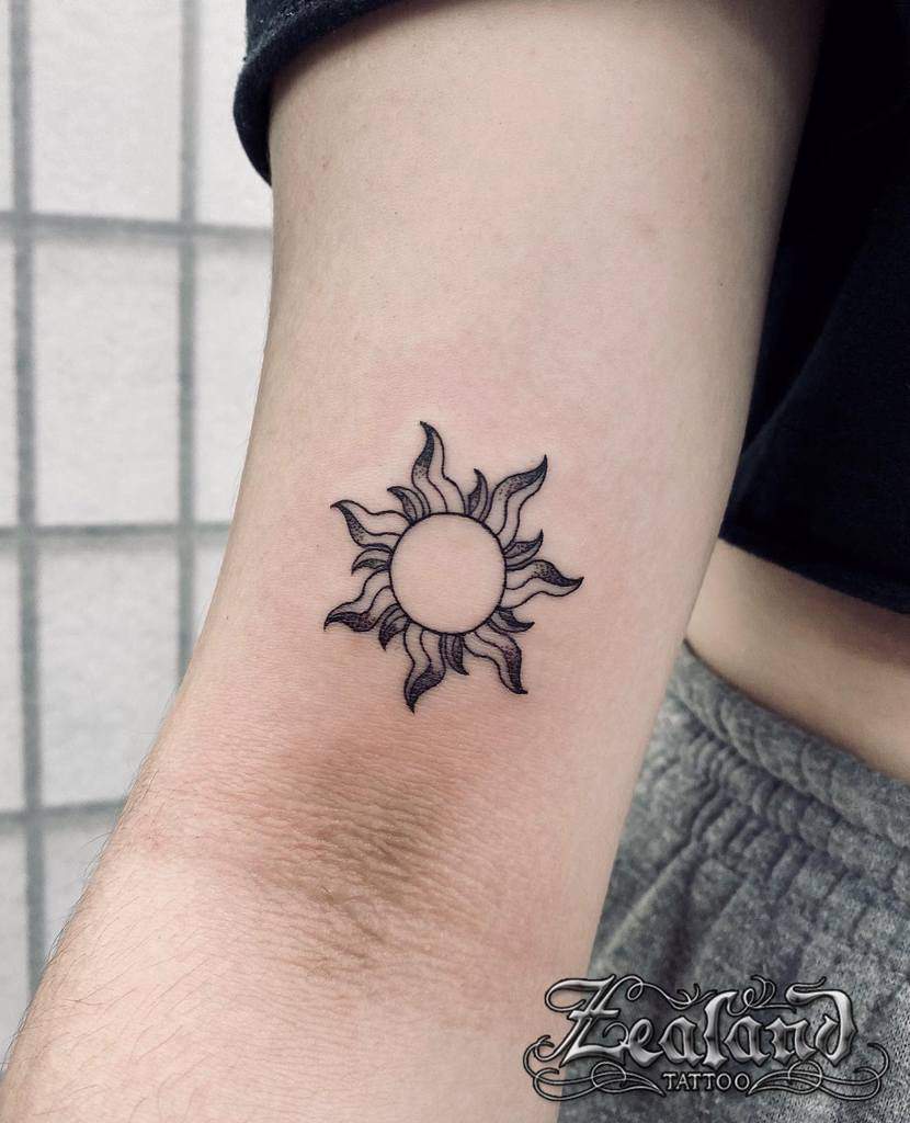 Simple Sun Upperarm Tattoo zealandtattoo