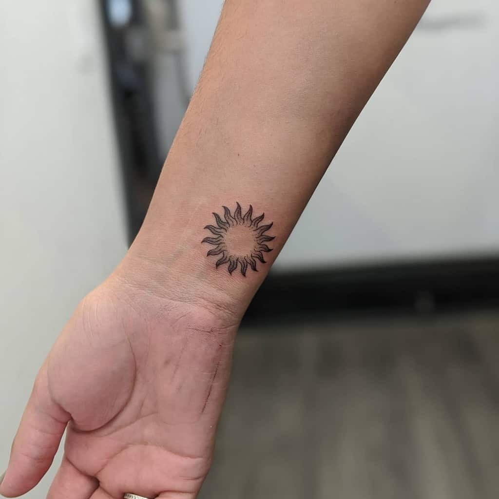 Simple Sun Wrist Tattoo lavender.tattoos
