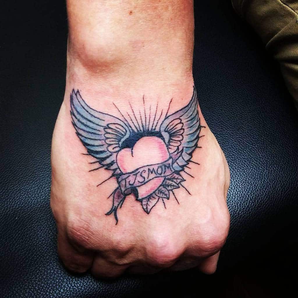 Smal Heart With Wings Tattoo derrickjaytattoos