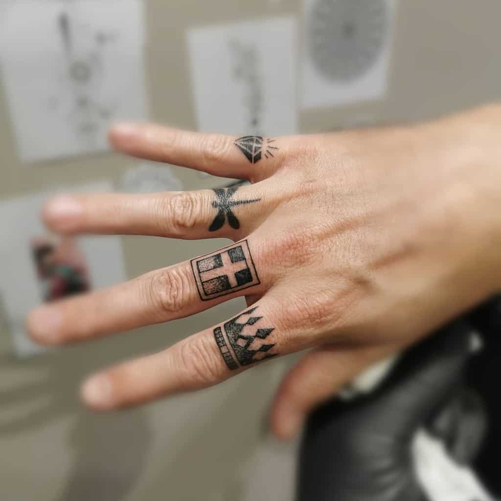 Small Cross Hand Finger Tattoo Yann Guitton Tattoo