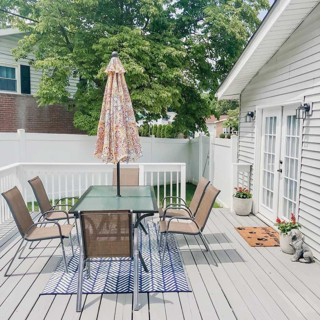 backyard deck glass table umbrella 