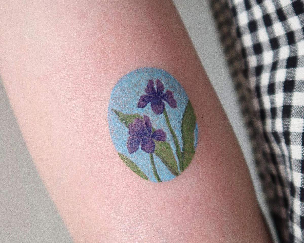 Iris Tattoo Meaning – What Do Iris Tattoos Symbolize?