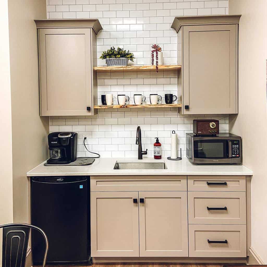 small kitchen white tile accent wall beige cabinets floating wood shelves 