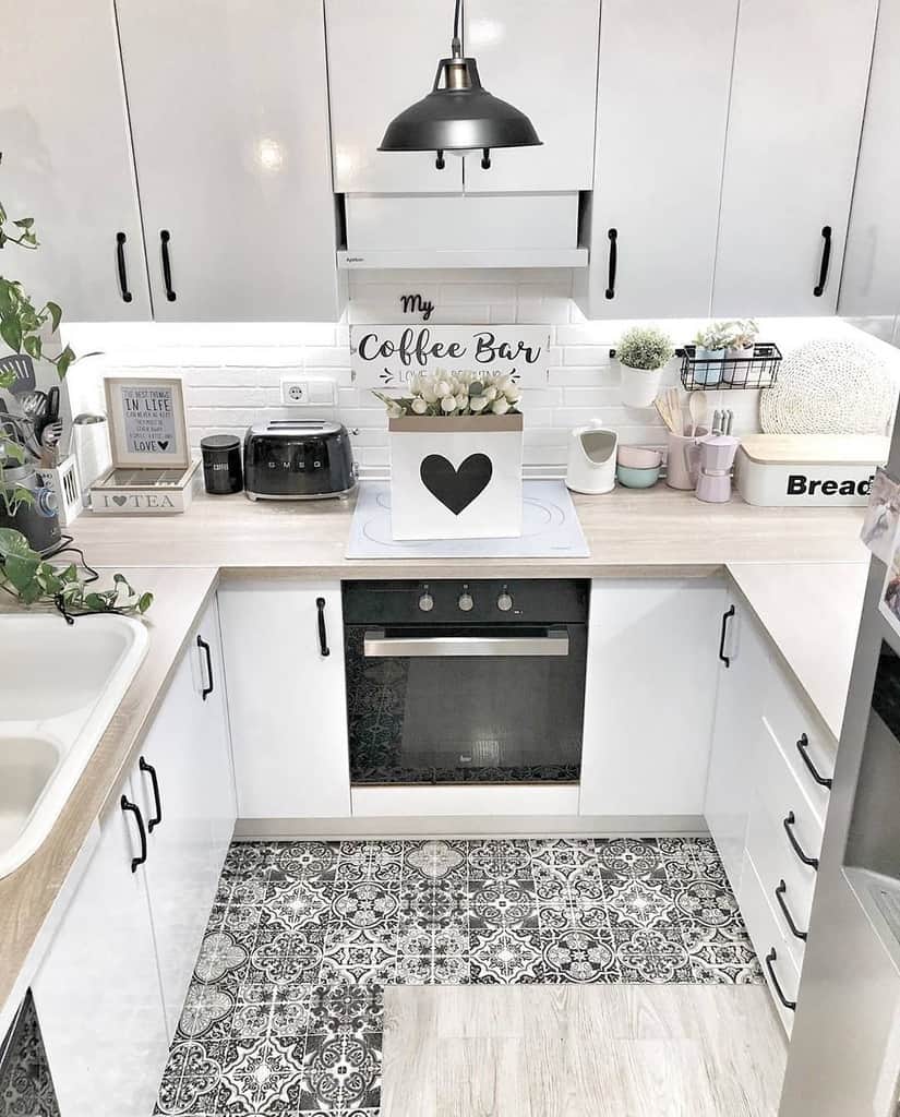 tiny white cabinet kitchen black accents white brick backsplash pattern floor tile 