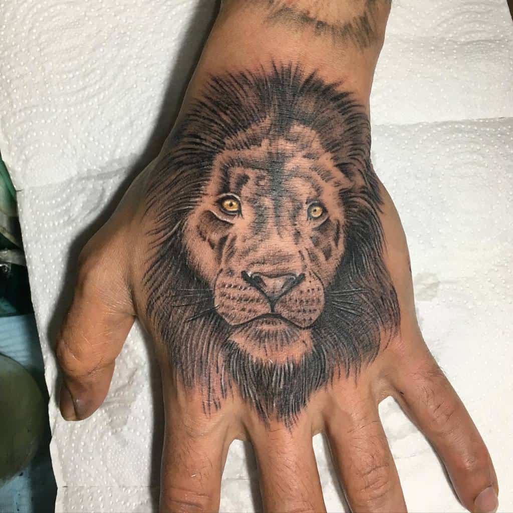 Small Lion Hand Finger Tattoos canvas_of_skin