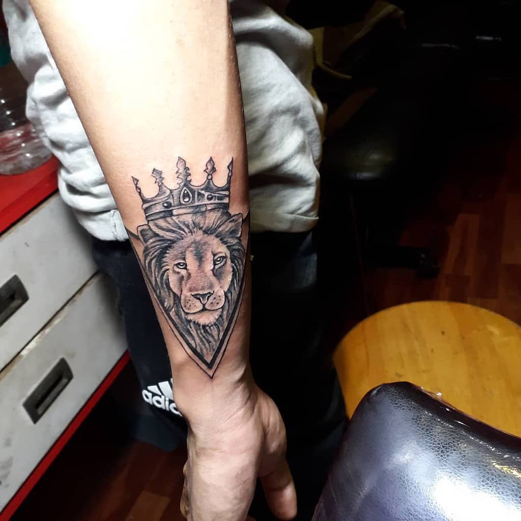 Small Lion Wrist Tattoos inkfusiontattoostudio