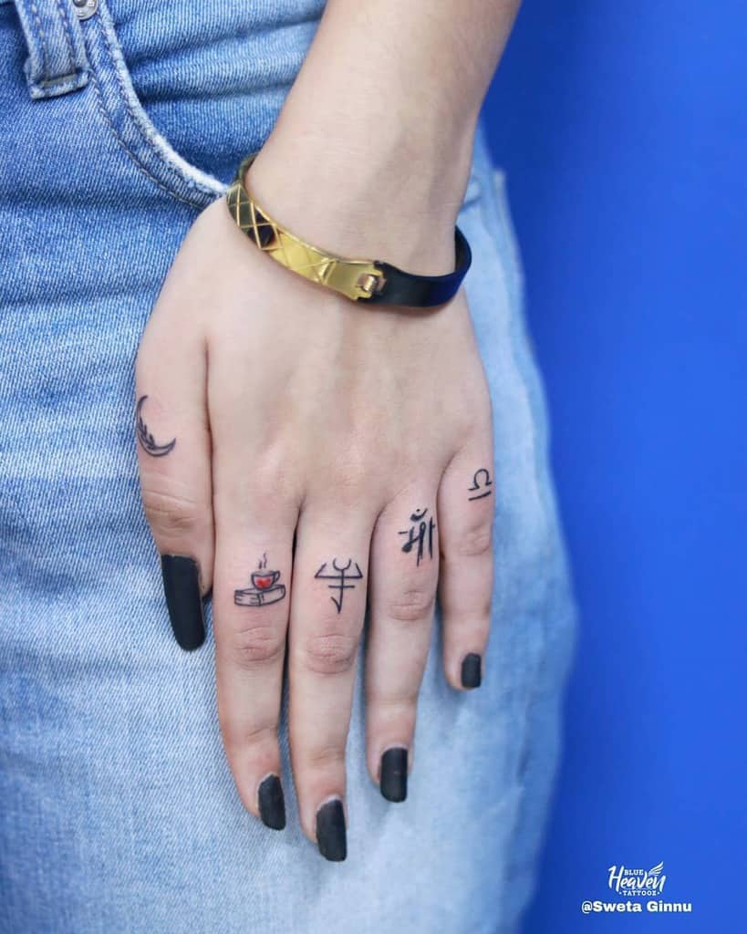 Small Symbol Finger Tattoos blue_heaven_tattooz