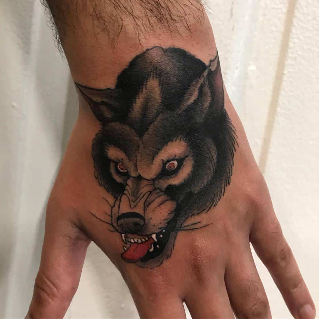 Small Wolf Hand Finger Tattoo joey_tattooer