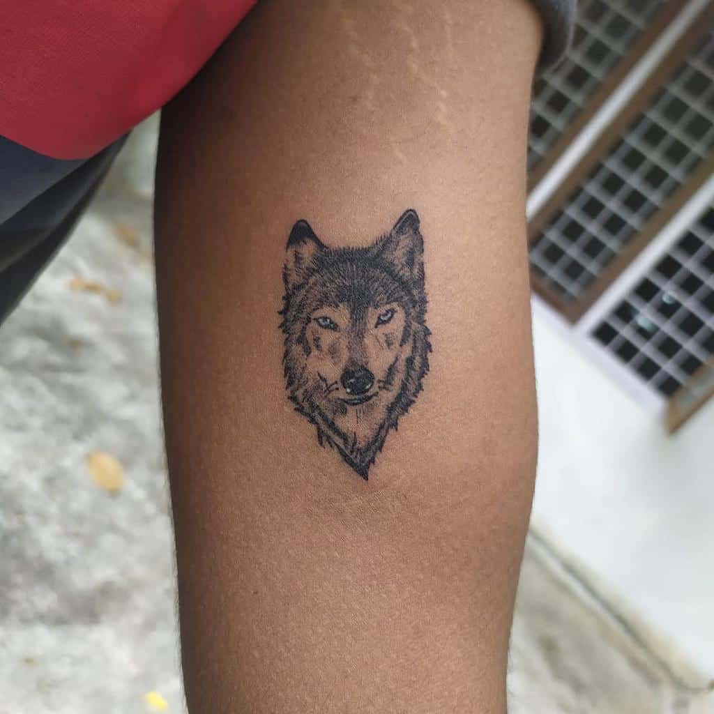 Small Wolf Upperarm Tattoo ink_spot_2.0