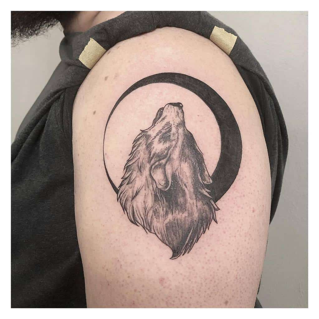 Small Wolf Upperarm Tattoo musa__tattoo