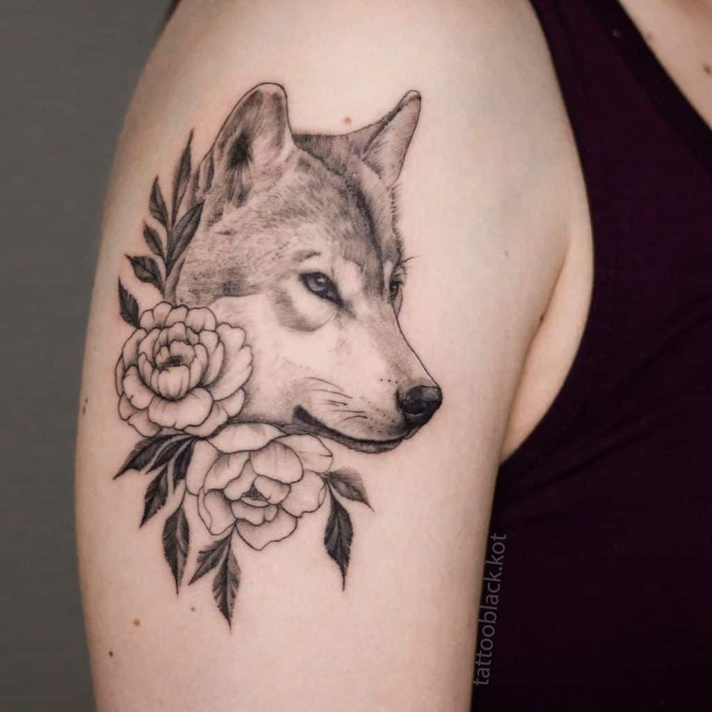 Small Wolf Upperarm Tattoo tattooblack.kot