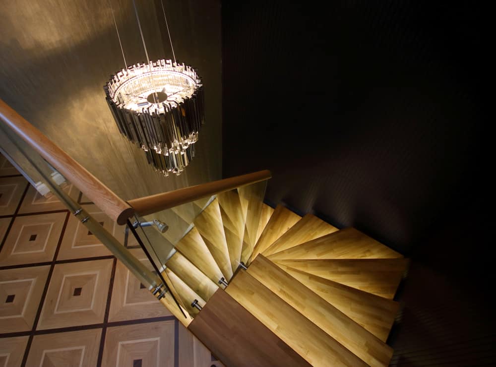 chandelier above staircase 
