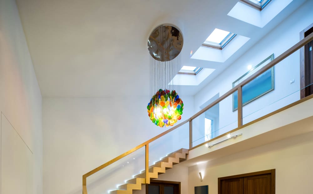 colorful chandelier above stairs 