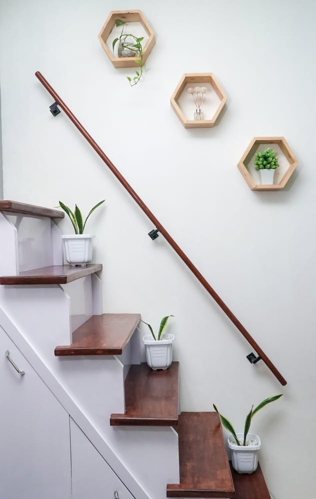 small staircase with wall railing 