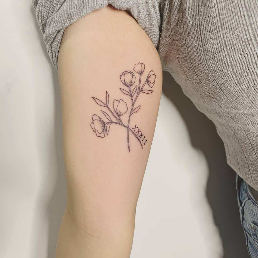 Sweet Pea Flower Upperarrm Tattoo sarahadskey