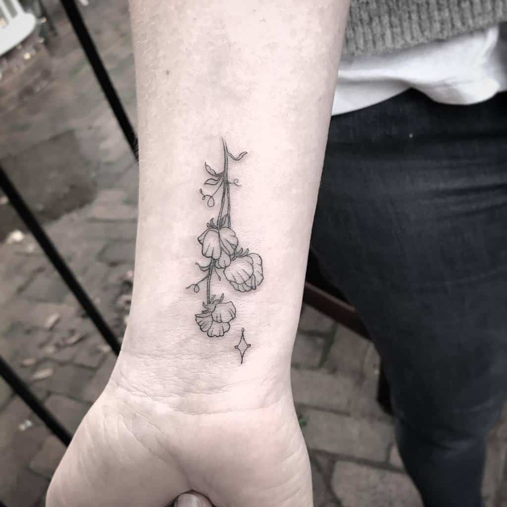 Single needle cotton flower tattoo on the ankle.