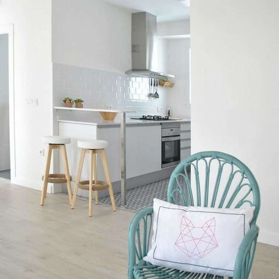 modern kitchen white tile splashback blue chair 