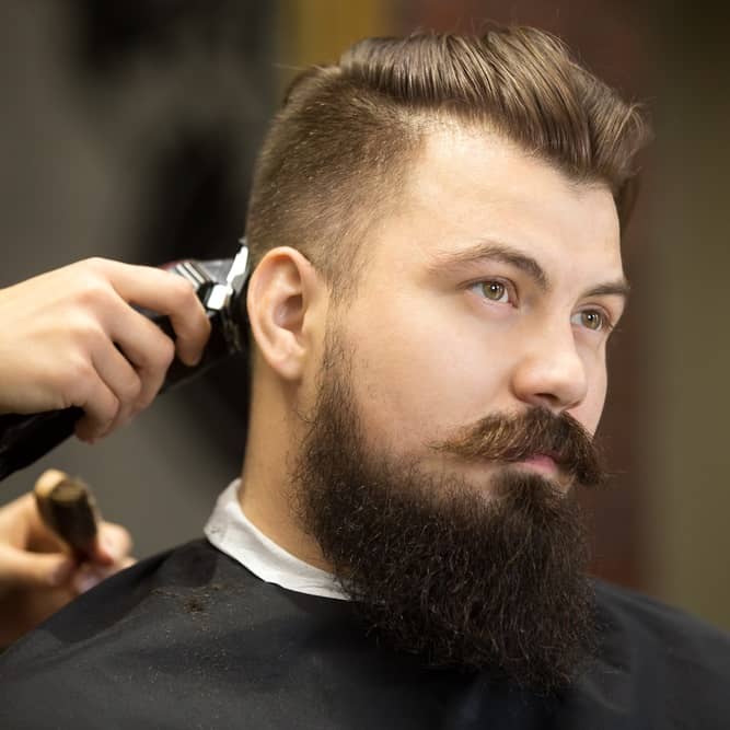 Man With Taper Fade Haircut With Short Pompadour