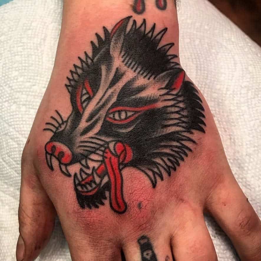 Traditional Wolf Hand Tattoo oldecitytattoo