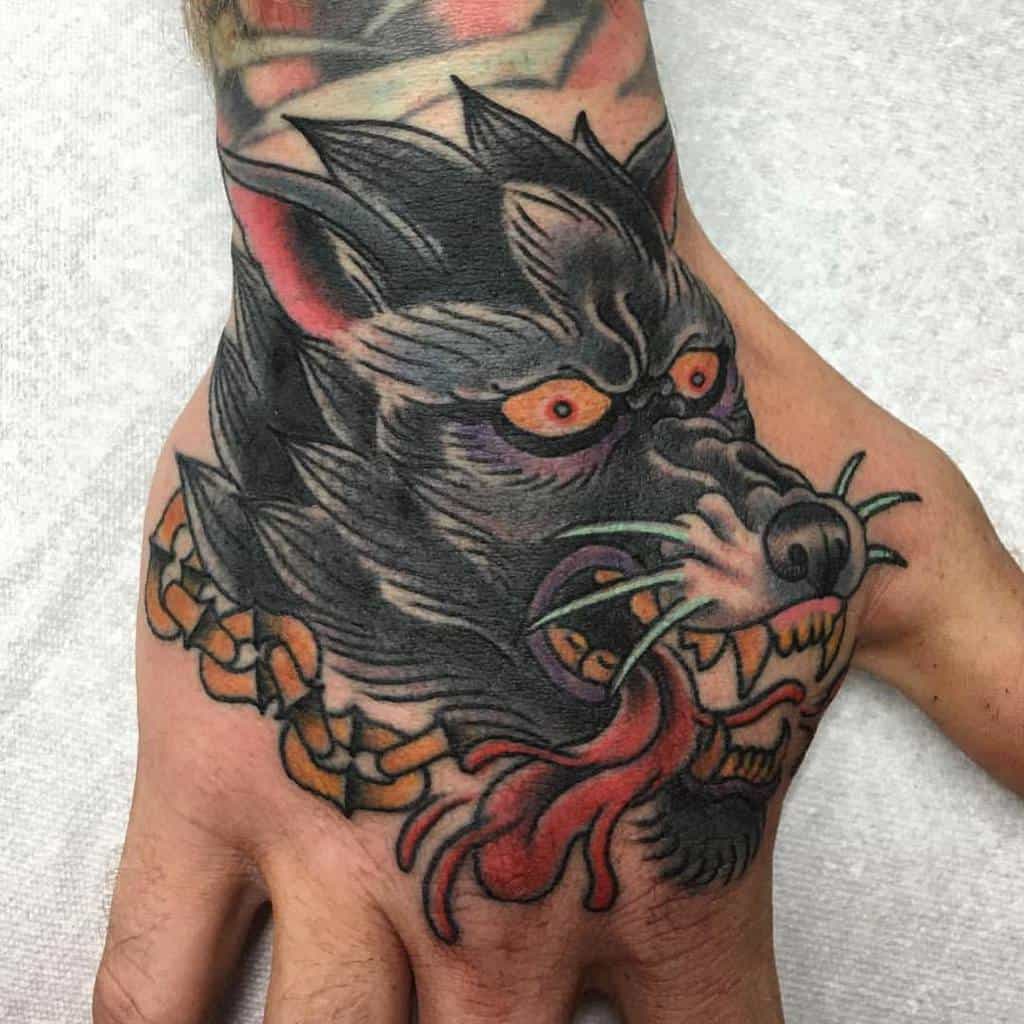 Traditional Wolf Hand Tattoo redwavetattoo