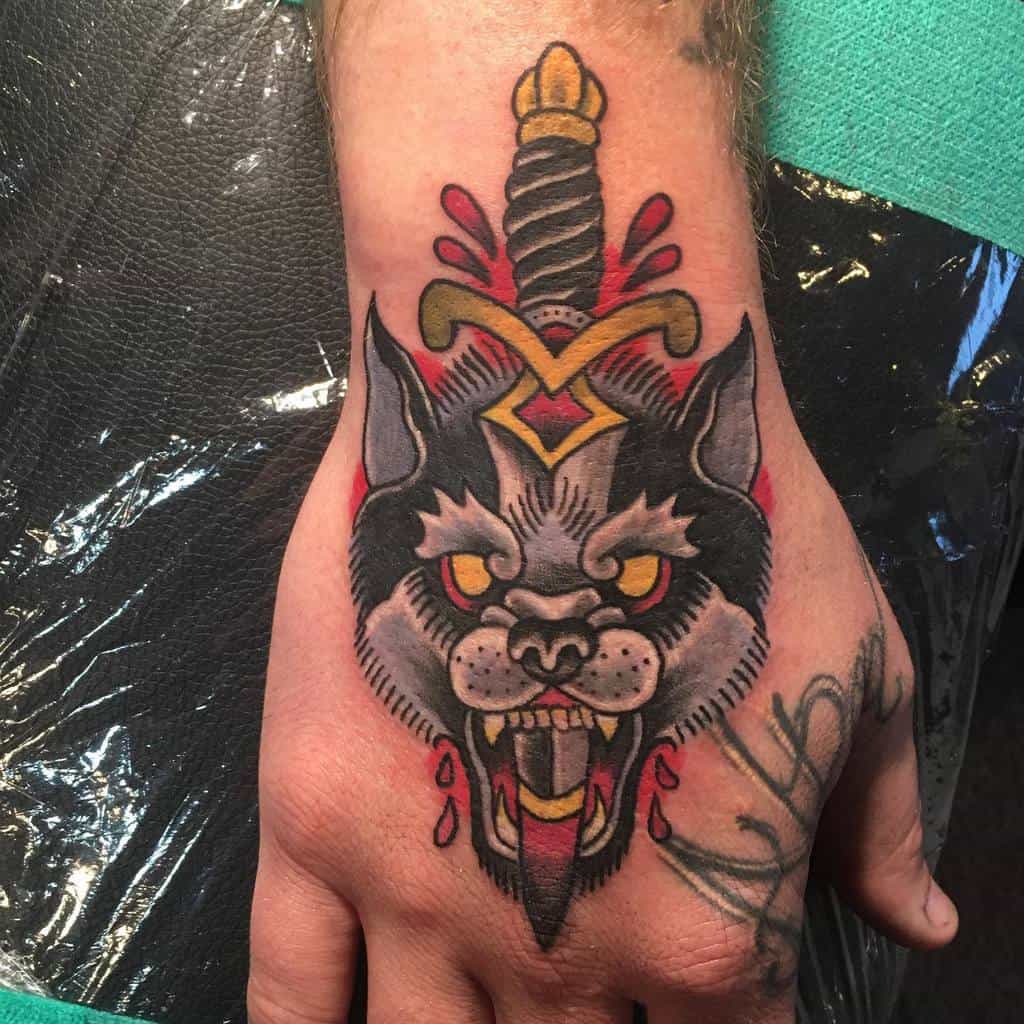 Traditional Wolf Hand Tattoo smilewormtattoos