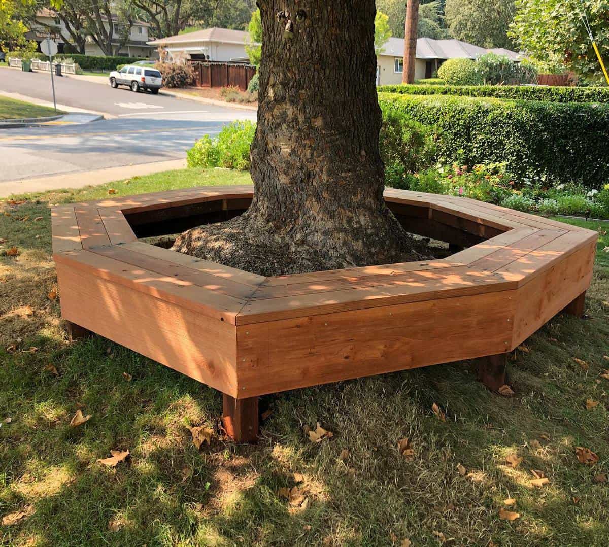 hexagonal wood bench around tree