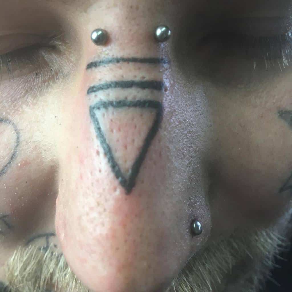 Tribal Face Nose Tattoo bpctattoos