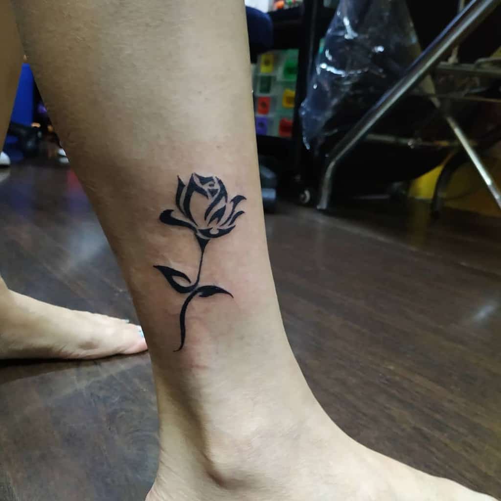 Tribal Flower Leg Tattoo twothumbtattoostudio_kl98