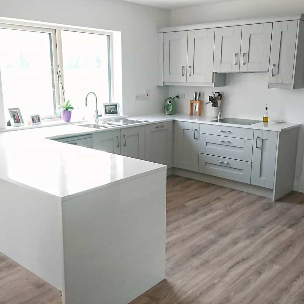 simple gray cabinet kitchen white countertop 