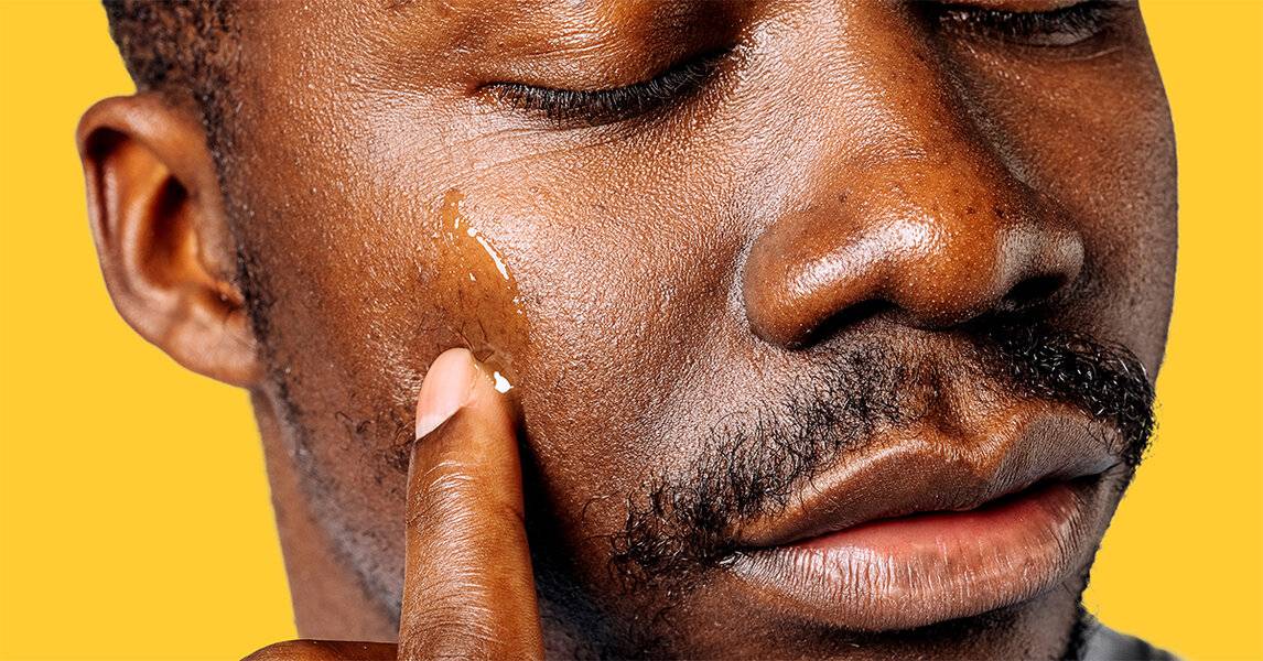 Geologie Vitamin C serum on face. Men's Skincare