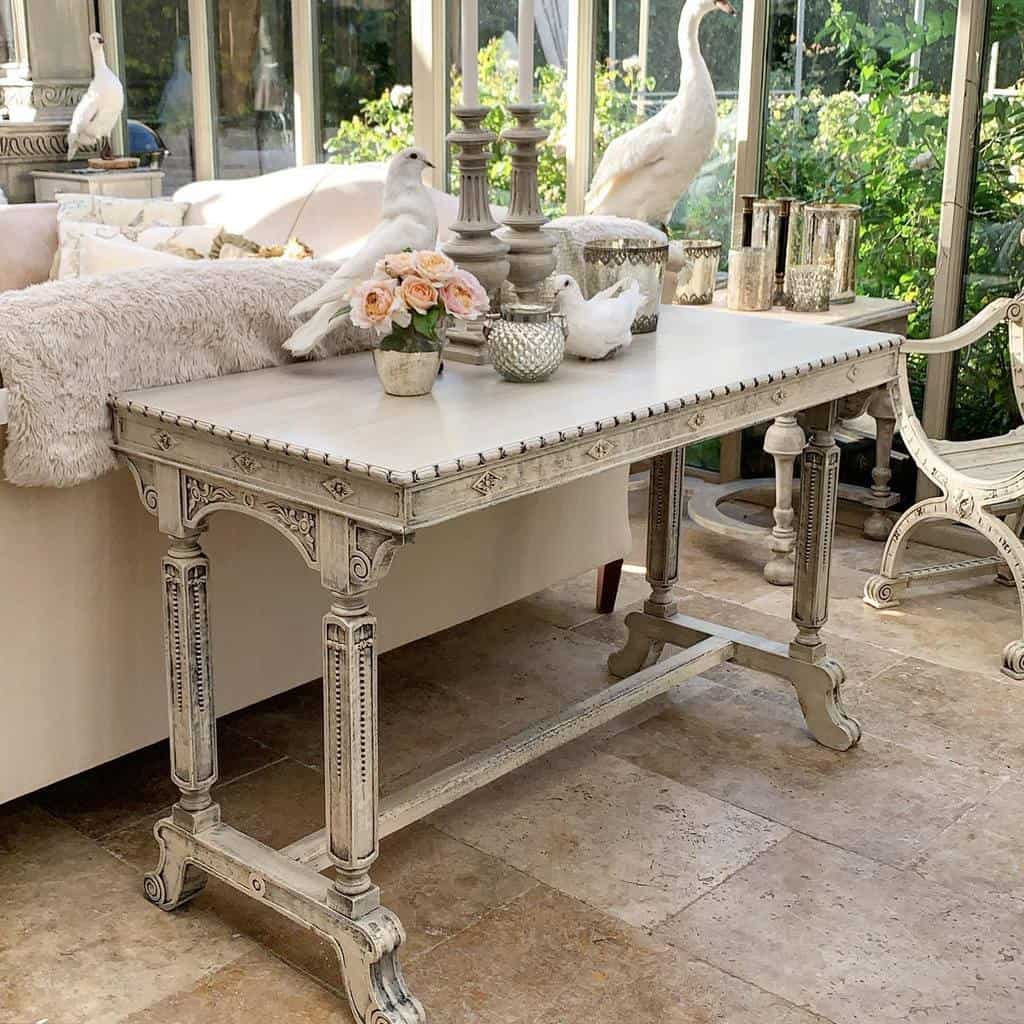 white vintage desk with candles and doves