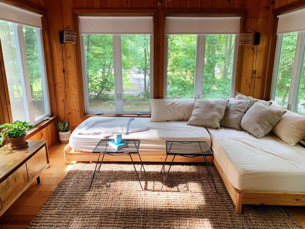 corner daybed in wood sunroom