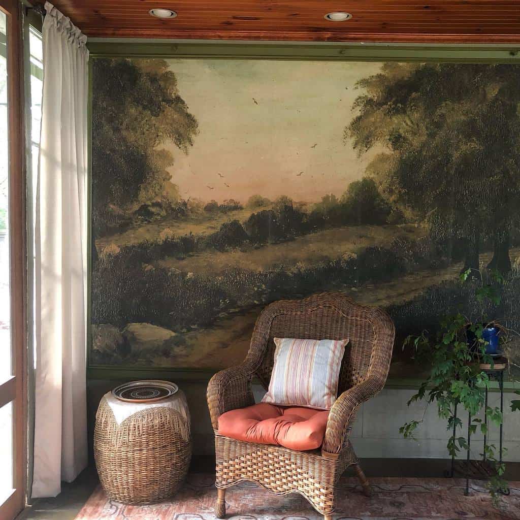 large canvas outdoor scene in sunroom with wicker furniture 