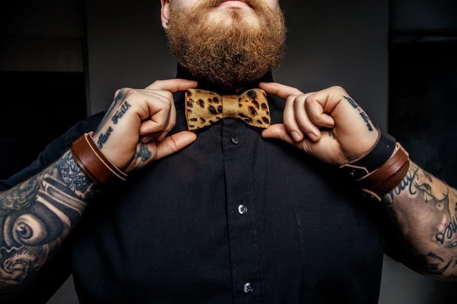 Visibly Tattooed Man with Bow Tie