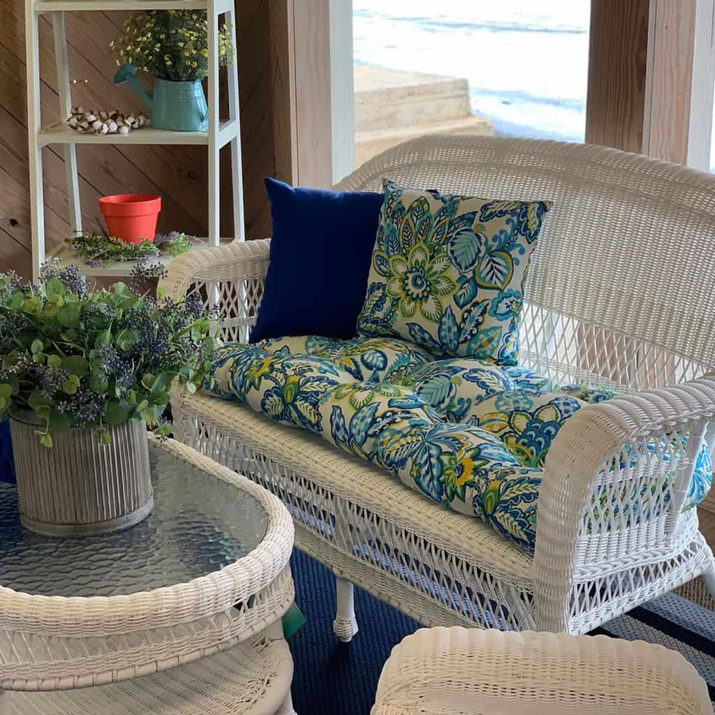 white wicker furniture in sunroom 