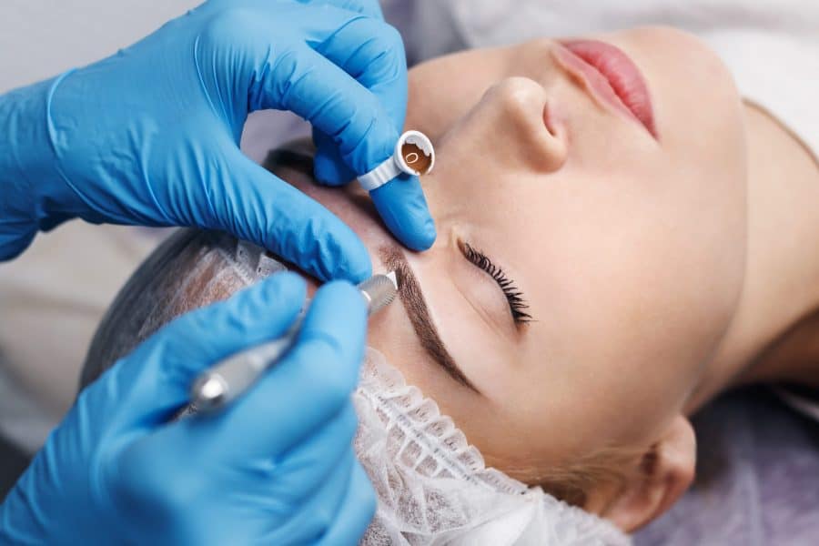 Woman Being Micrbladed New Cosmetic Eyebrow