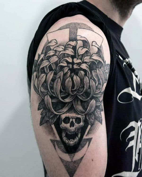 Abstract Chrysanthemum Flower Dotwork Tattoo On Mans Upper Arm With Skull