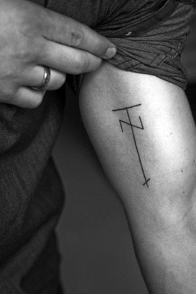 Abstract Cross Bicep Line Tattoo For Men