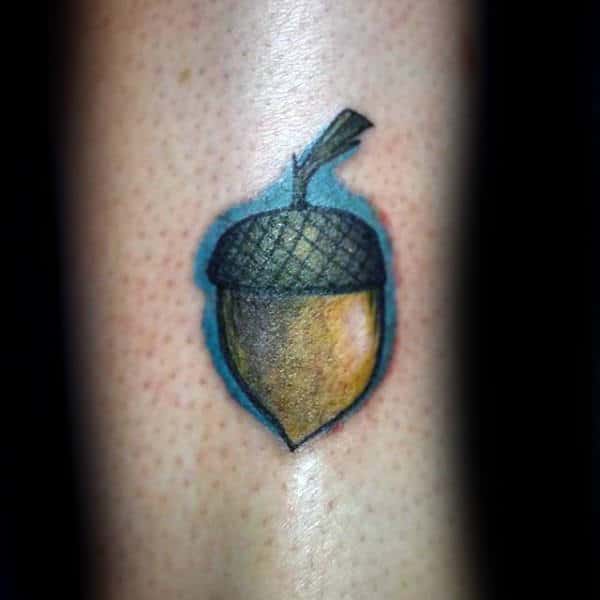 Acorn With Blue Ink Background Tattoo For Men