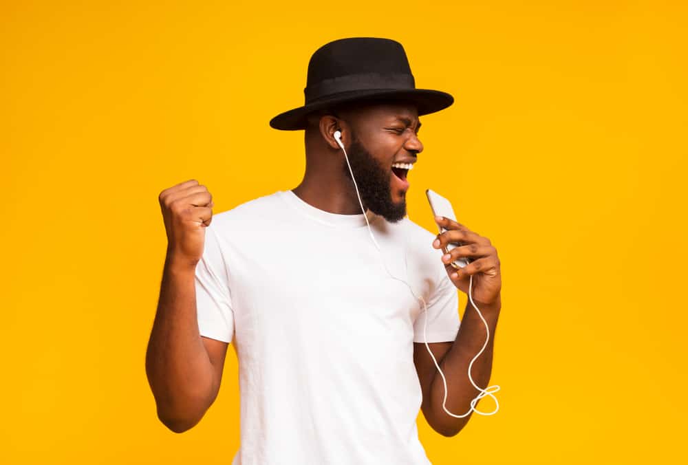 black hat african guy singing
